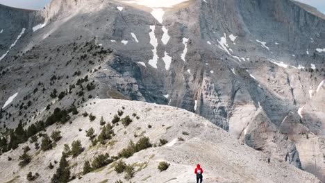Adventurous-Hiker-Crosses-The-HIgh-Alpine-Plateau-In-Mount-Olympus-In-Greece---Tilt-Up-Shot