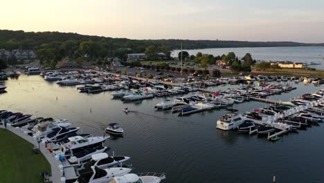 Boats-docked-at-the-marina-at-Lake-Geneva,-Wisconsin-from-a-aerial-view