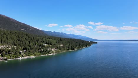 Flathead-Lake,-Montana,-Drone-rising-up-above-beautiful-landscape