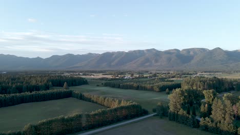 Drone-panning-over-Montana-fields-with-mountains-in-Background---Aerial