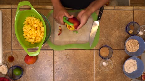 Peeling-and-dicing-peaches-for-a-homemade-recipe---overhead-isolated-view
