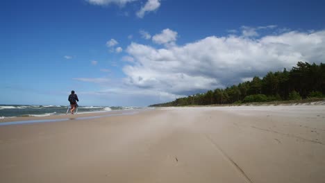 Man-Walking-on-Sandy-Beach.-Baltic-Sea-Poland