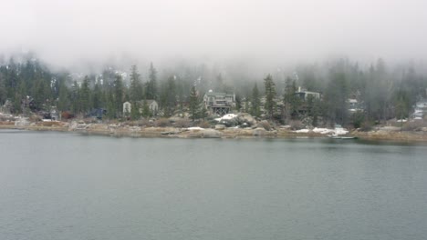 Aerial-4K-footage-of-Big-Bear-Lake's-shore-with-spooky-fog
