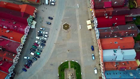 Bird's-eye-shot-flying-over-picturesque-medieval-town-Telc-in-the-Czech-Republic