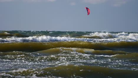 Windsurfer-Falling-in-Water-on-High-Waves-of-Baltic-Sea,-Poland