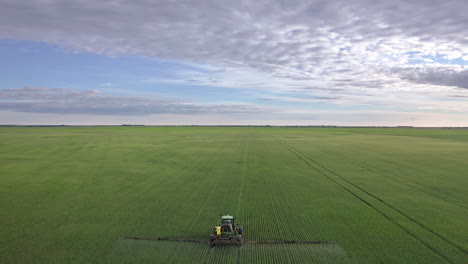 Tractor-spraying-fungicide-on-large-areas-of-cereal-crops