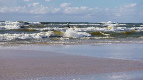 Kitesurfing-on-High-Waves-in-Strong-Wind-on-Baltic-Sea,-Poland