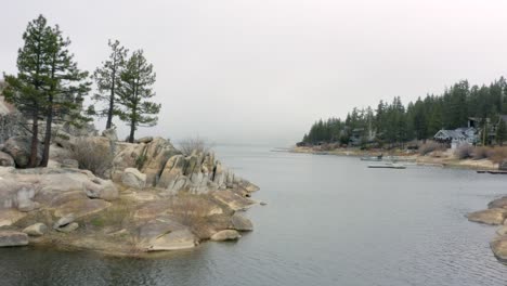 Aerial-4K-footage-of-Big-Bear-Lake's-shore-with-spooky-fog