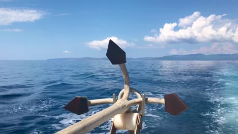 Closeup-of-large-iron-drop-anchor-at-the-back-of-sailing-ship-in-4k-in-Sithonia-on-Mediterranean-sea
