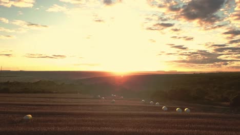 Heavenly-golden-sunset-over-a-beautiful-farm-field-landscape