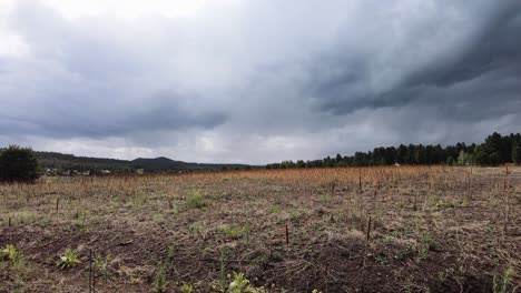 Time-lapse-storm-clouds-pass-over-open-in-field-in-Northern-Arizona,-Williams,-Arizona