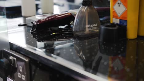 Barbershop-counter-top-with-electric-razor-and-hair-brush
