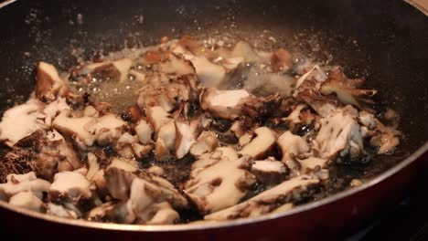 Close-up-of-sauteing-maitake-mushrooms-in-bubbling-butter