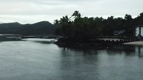 Drone-footage-over-calm-ocean-Coral-Coast-Fiji-Island-beach-hotel-resort