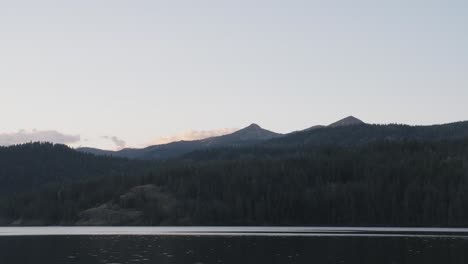 A-scenic-view-of-a-north-Idaho-lake-and-mountain-peaks-at-sunset-near-the-border-of-Canada