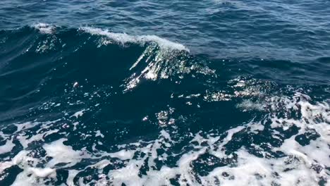 Sailboat-engine-creating-wave-crest-in-deep-Mediterranean-sea-in-4k