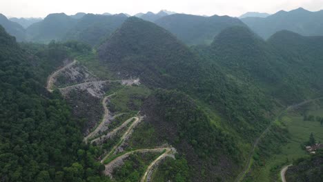Aerial-View-of-Windy-Road-on-Hillsdie-in-Ha-Giang-Loop-Vietnam