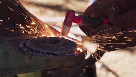 Cutting-a-circular-Piece-of-Metal-with-a-Cutting-Blow-Torch---Slowmo