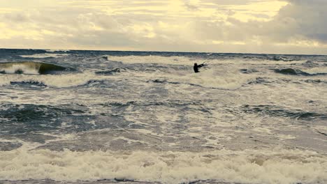 A-kiteboarder-runs-on-the-sea-waves