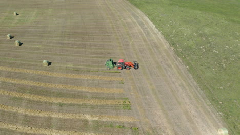 Birds-eye-view-ot-a-tractor-baling-hay-in-Saskatchewan-Canada