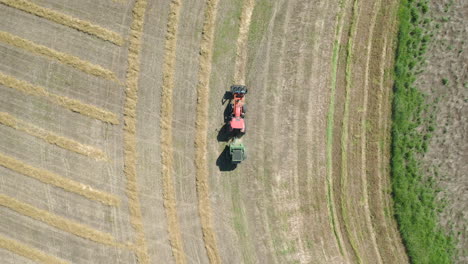 Stunning-aerial-view-of-tractor-baling-hay