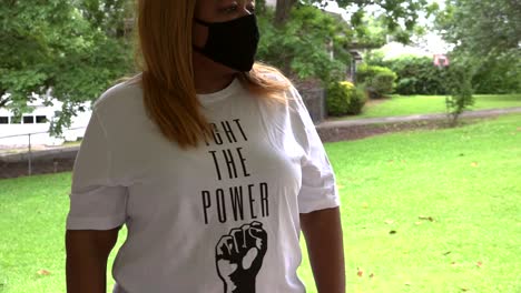 Black-Woman-standing-wearing-protective-mask