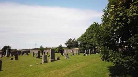 Old-graveyard-with-gravestones-in-the-Scottish-countryside-on-a-quiet-sunny-day