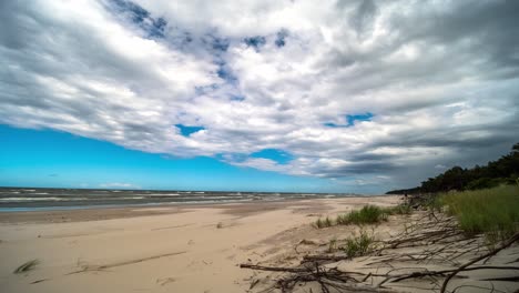 Clouds-Rolling-Over-Sandy-Beach-and-Sea-Timelpase