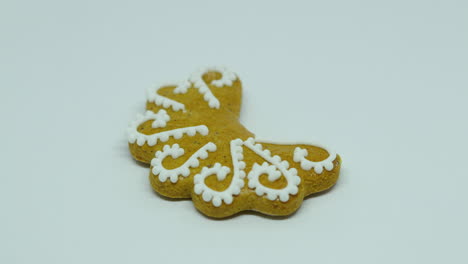 Zoomed-out-pastry-gingerbread-with-white-decoration-on-top-in-the-shape-of-the-moon-on-a-white-background
