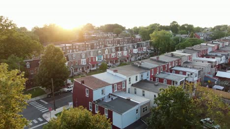 Aerial-reveal-of-congested-housing-projects-in-United-States-of-America,-American-urban-city-poverty,-beautiful-dramatic-lighting,-establishing-shot