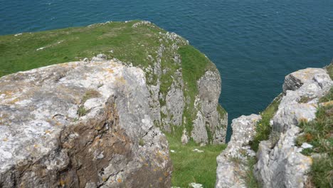Grassy-rocky-Great-Orme-cliff-edge-mountain-view-overlooking-scenic-sea-view