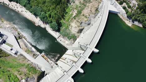 Magnificent-White-Structure-Of-The-Ribeiradio-Dam-In-Portugal---aerial-shot