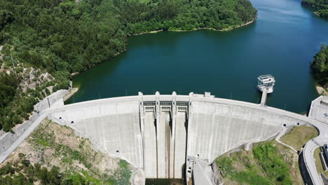 Massive-White-Ribeiradio-Dam-In-Vouga-River-Connecting-Islands-In-Aveiro-Portugal-And-Producing-Power---aerial-shot