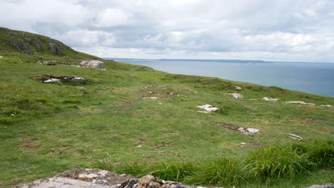 Grassy-rocky-Great-Orme-mountain-edge-view-overlooking-scenic-sea-view