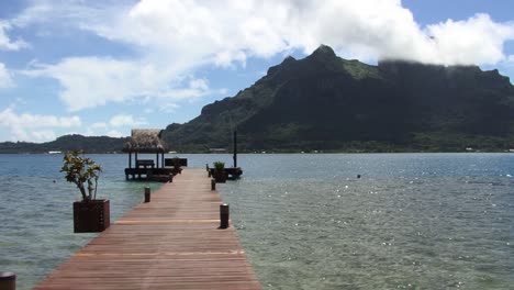 Small-pontoon-in-Bora-Bora-and-view-to-Mount-Otemanu,-French-Polynesia