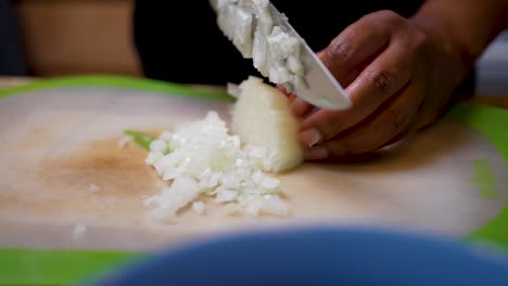 Chopping-and-dicing-a-fresh-onion-for-a-homemade-recipe---slow-motion
