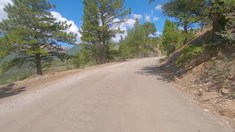 POV-driving-up-a-gravel-mountain-pass-in-the-Rocky-Mountains-of-Colorado---off-road-adventure