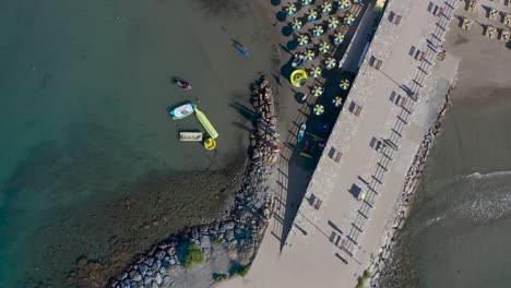drone-shot-of-a-beach-in-Andora,-Liguria