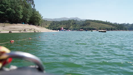 Enjoy-Water-Skiing-On-Emerald-Green-Waters-At-The-Lake-In-Albufeira-Da-Barragem-Do-Ermal,-Portugal---Long-Shot
