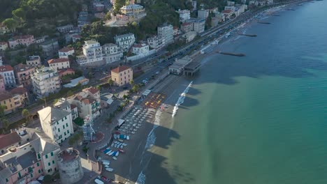 drone-shot-above-the-city-of-Laigueglia,-Liguria-during-sunset