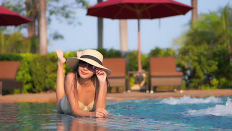 Sensuous-asian-model-summer-look-posing-at-a-pool