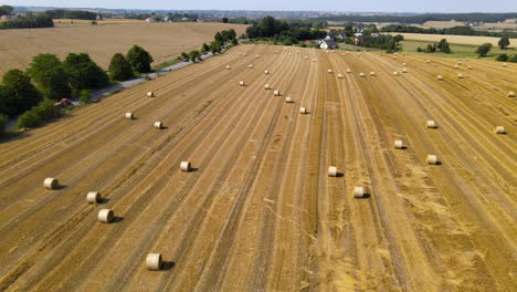 Aerial-view-over-fields-of-hay-bales-on-a-Polish-farm-in-Northern-Europe
