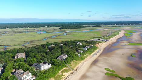 Cape-Cod-Bay-Aerial-Drone-Footage-of-Bay-Side-Beach-at-Low-Tide,-Houses,-Marsh-and-People-in-Ocean
