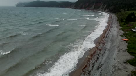 Ocean-Waves-Rolling-On-The-Perce-Coast-On-A-Foggy-Morning-Near-The-Gaspe-Peninsula-In-Quebec,-Canada