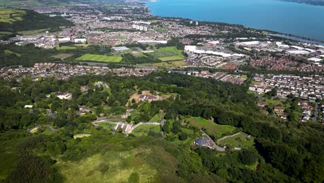 Rotating-aerial-view-of-Belfast-Zoo-and-Newtownabbey-from-Cavehill