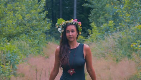 Dreamy-Scene-With-Sensual-Young-Woman-With-Flower-Wreath-on-Head-Between-Trees