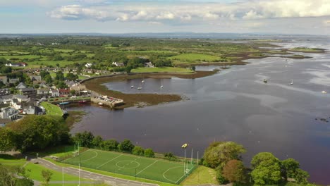 Kinvara,-Galway,-Ireland,-August-2020,-Drone-slowly-descending-while-pushing-towards-fishing-village