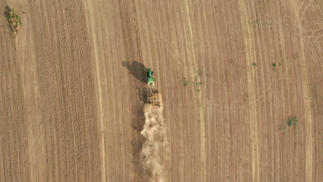 Agricultural-Tractor-Tilling---Plowing-the-Farm-Land---Overhead-Aerial-Drone-View
