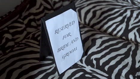 Reserved-for-bride-and-groom-sign-on-couch