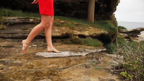 Legs-Of-A-Woman-Walking-And-Tiptoeing-On-The-Rocks---Rocky-Coast-Of-Beach-In-The-Eastern-Suburbs---New-South-Wales,-Australia